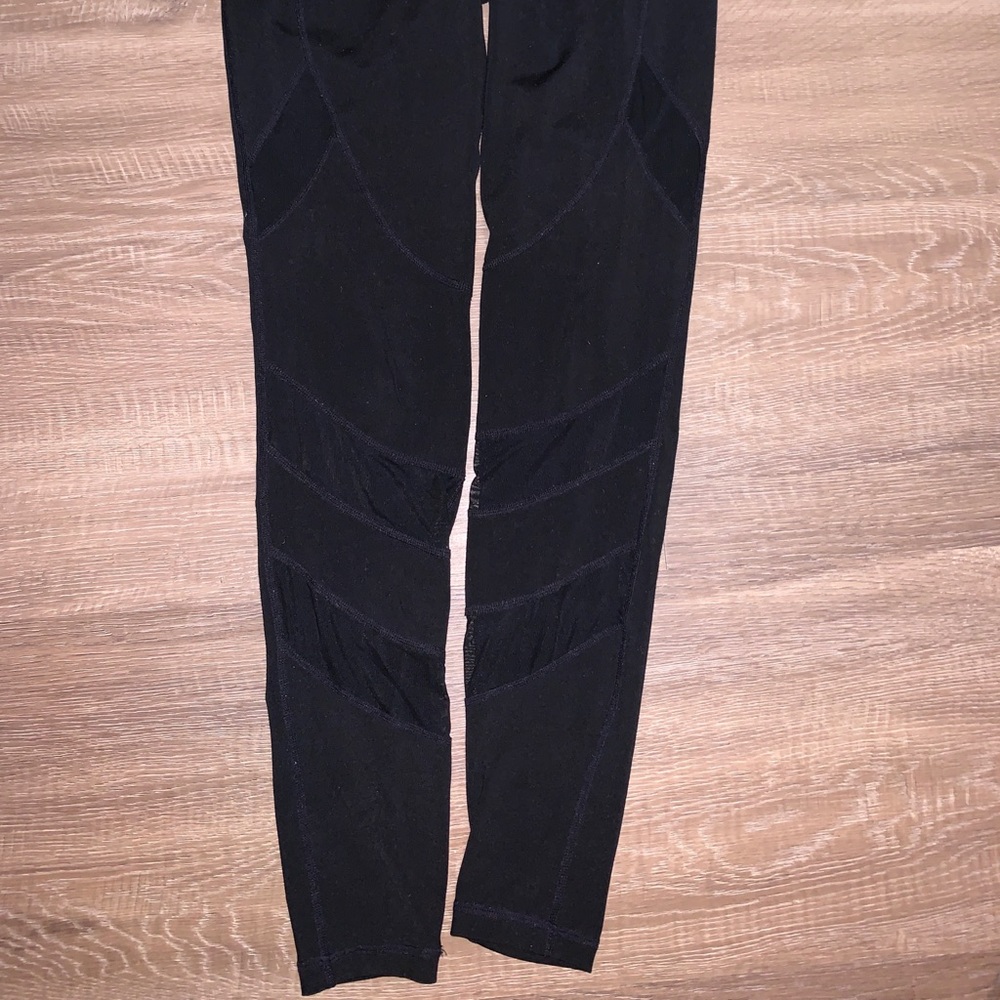 Long black leggings with mesh cutouts